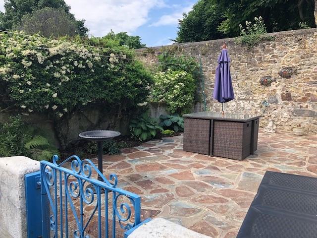 Relax on the suntrap patio, soaking up the afternoon sunshine.