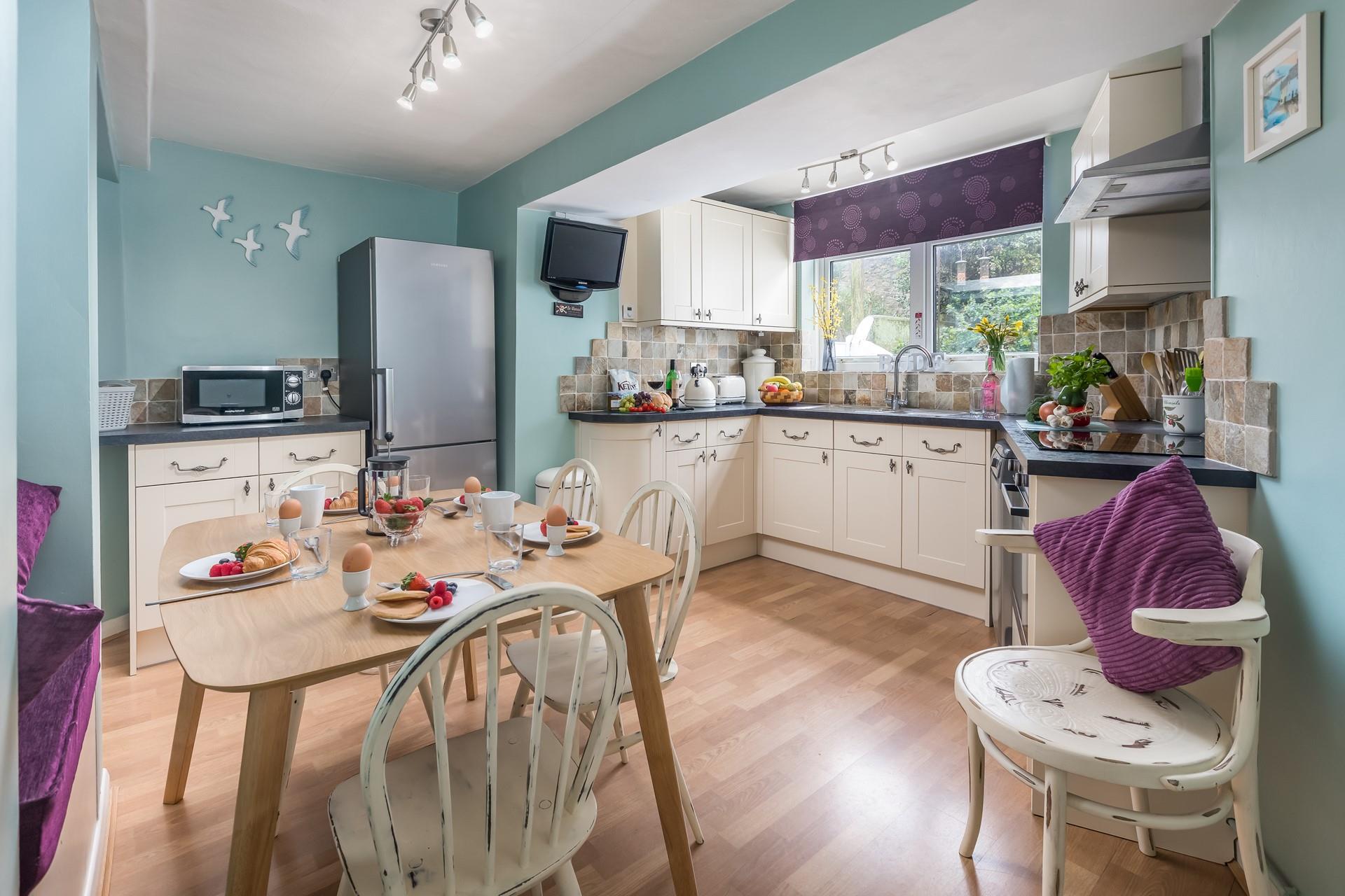 The kitchen is spacious and well-equipped for cooking tasty meals.
