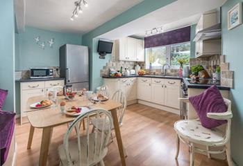 The kitchen is spacious and well-equipped for cooking tasty meals.