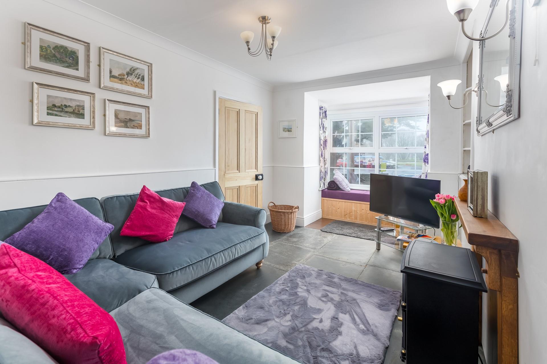 The sitting room at the front of the house is perfect for friends and family to relax each evening.