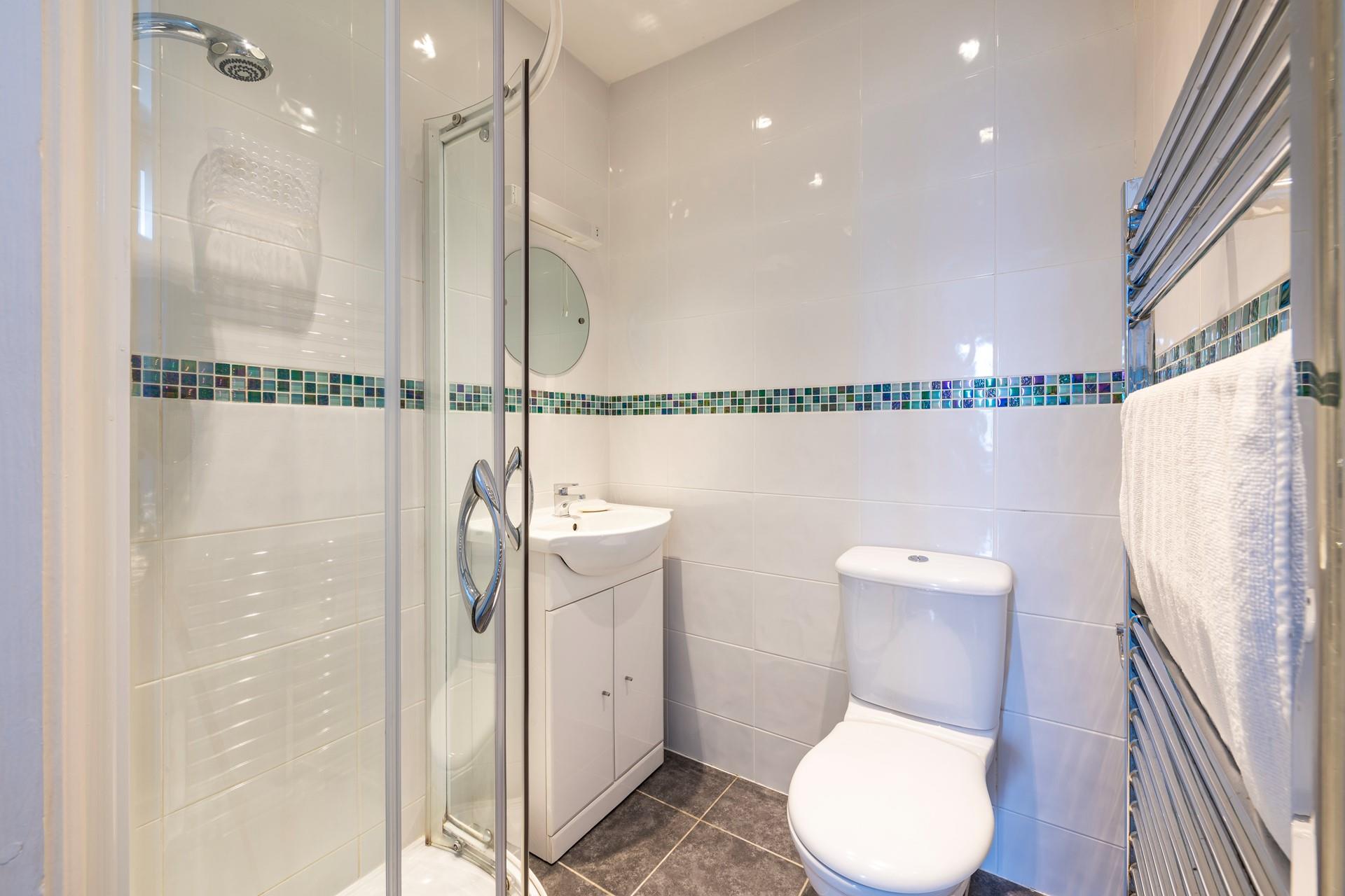 Wander into the ensuite to take an invigorating morning shower.