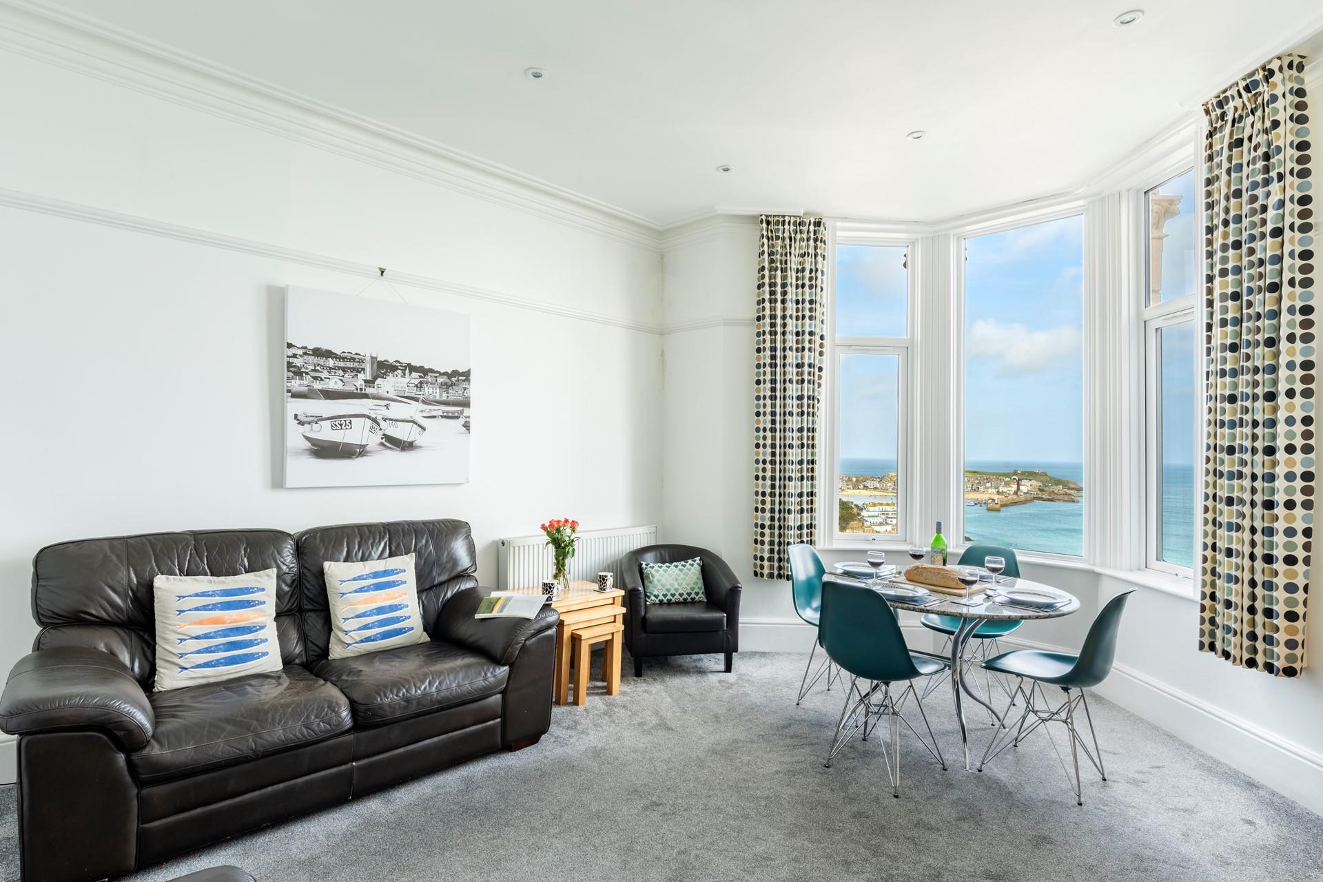 The sitting room area has a full bay window which has a stunning sea view over St Ives.