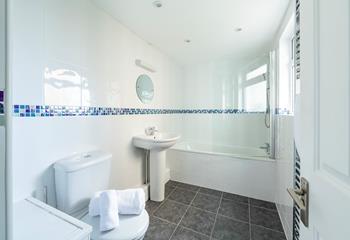 The family bathroom is perfect for a morning shower or relaxing bath.