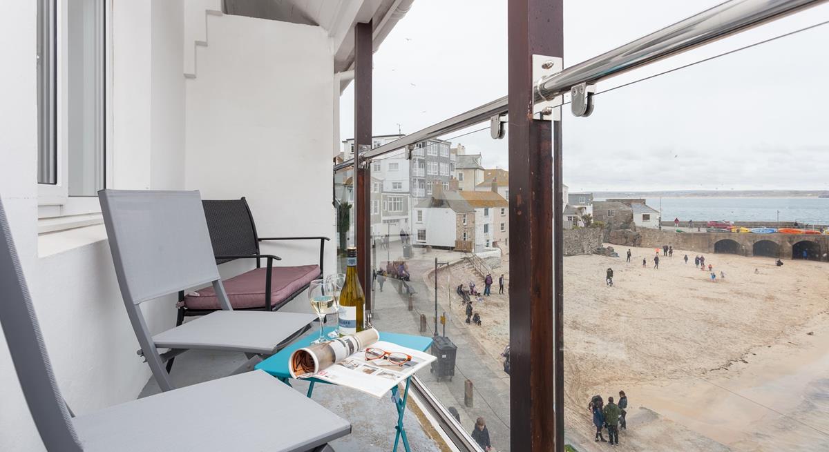 Watch the comings and goings of the harbour from the balcony.