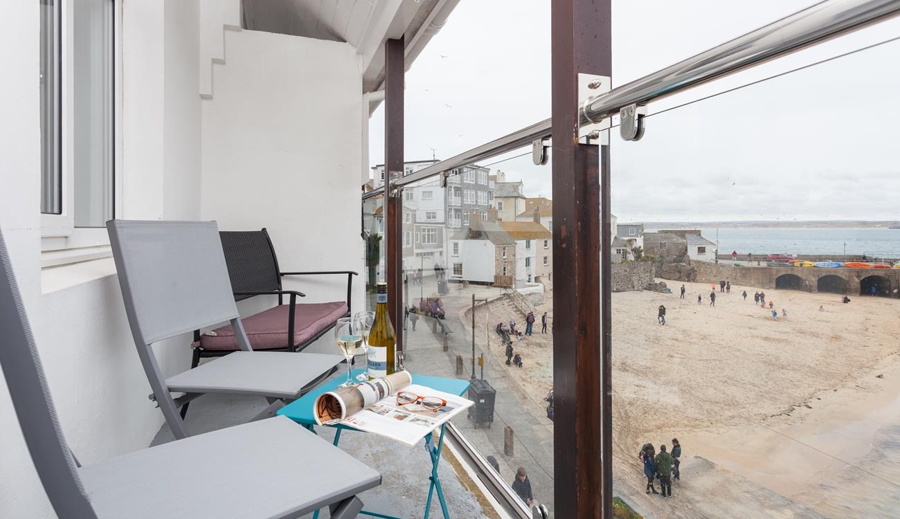 Watch the comings and goings of the harbour from the balcony.