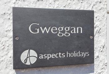 A traditional slate sign helps make the property easy to find.