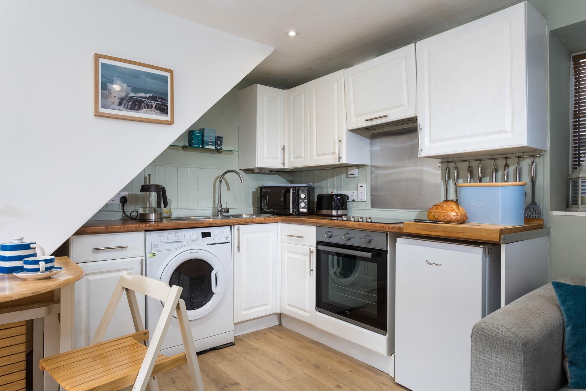 Beautifully designed, the kitchen brings the magic and beauty of the seaside indoors.