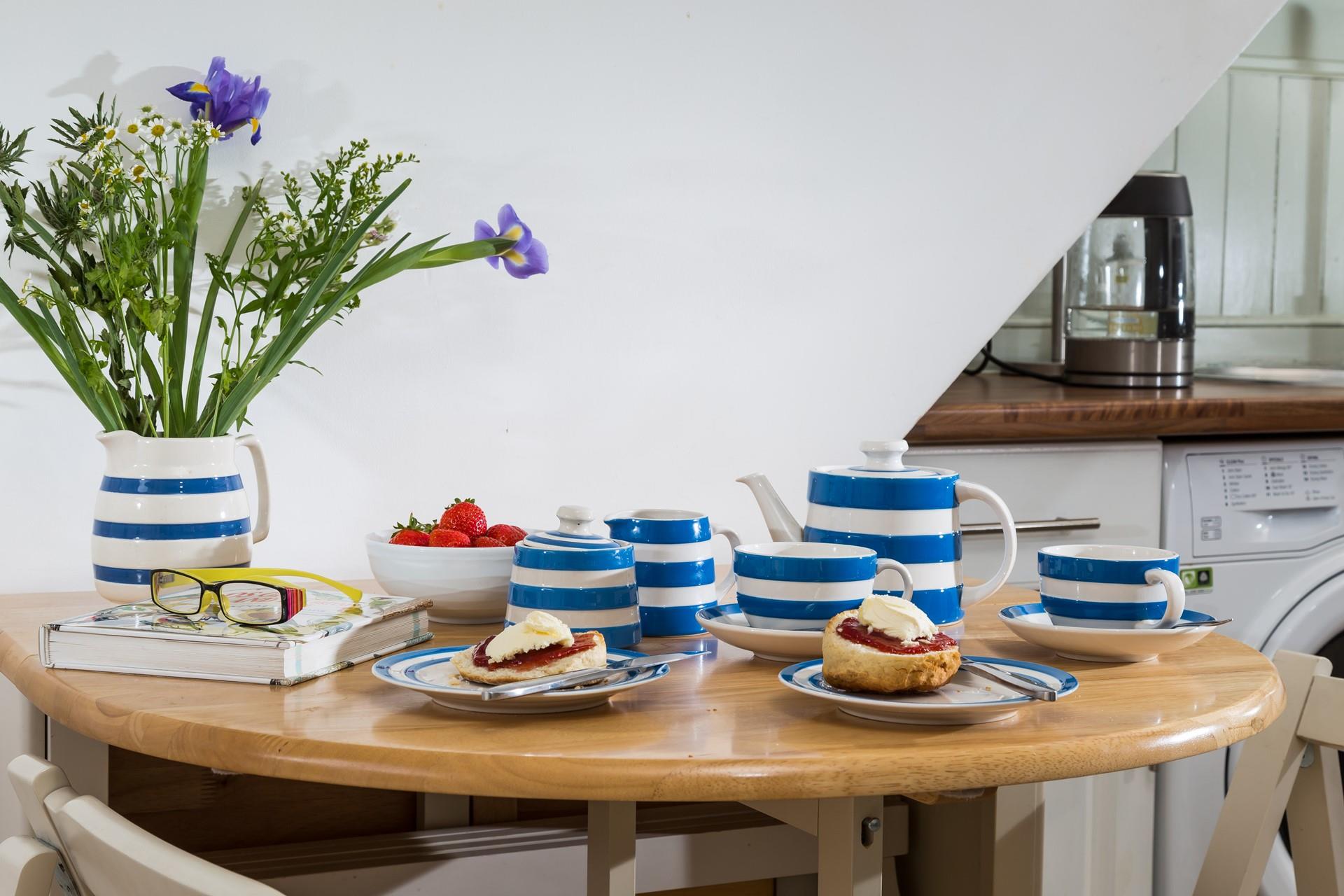 Cornish blue and cream pottery is a cheery and fresh look on the dining table.