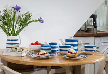 Cornish blue and cream pottery is a cheery and fresh look on the dining table.