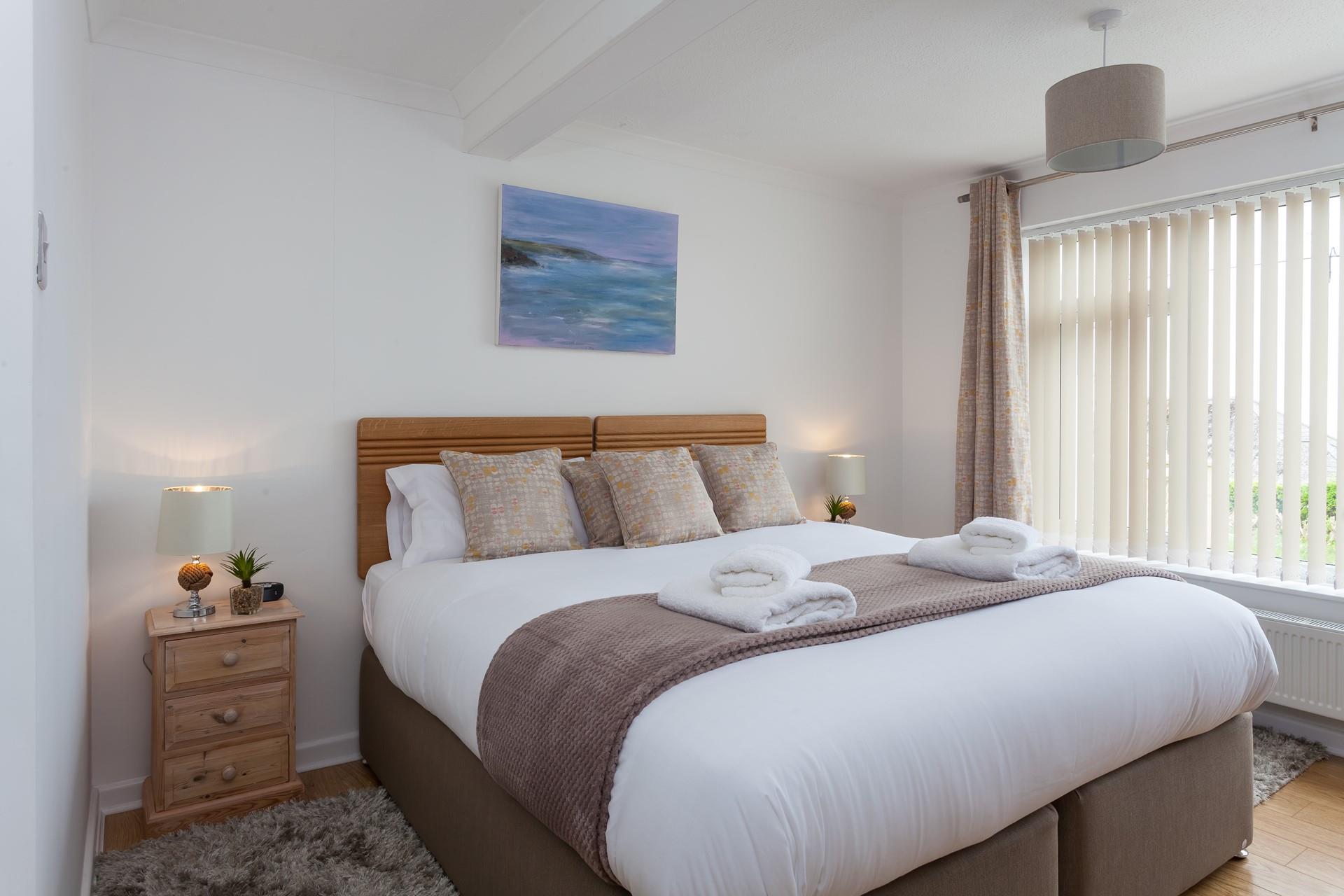 Soft earthy tones have created a soothing atmosphere, perfect for unwinding after a day of adventures by the sea!