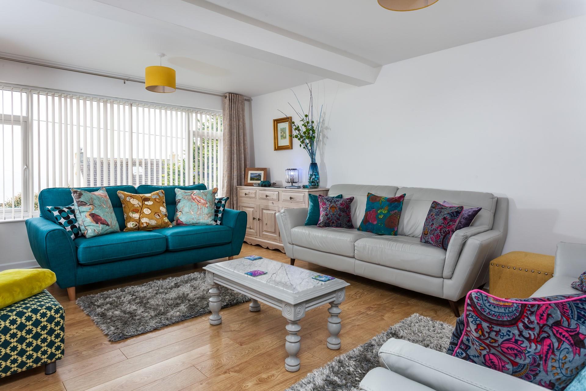 Decorated in a vibrant mixture of colours and textures, this spacious and plush lounge offers a gorgeous space to relax together.