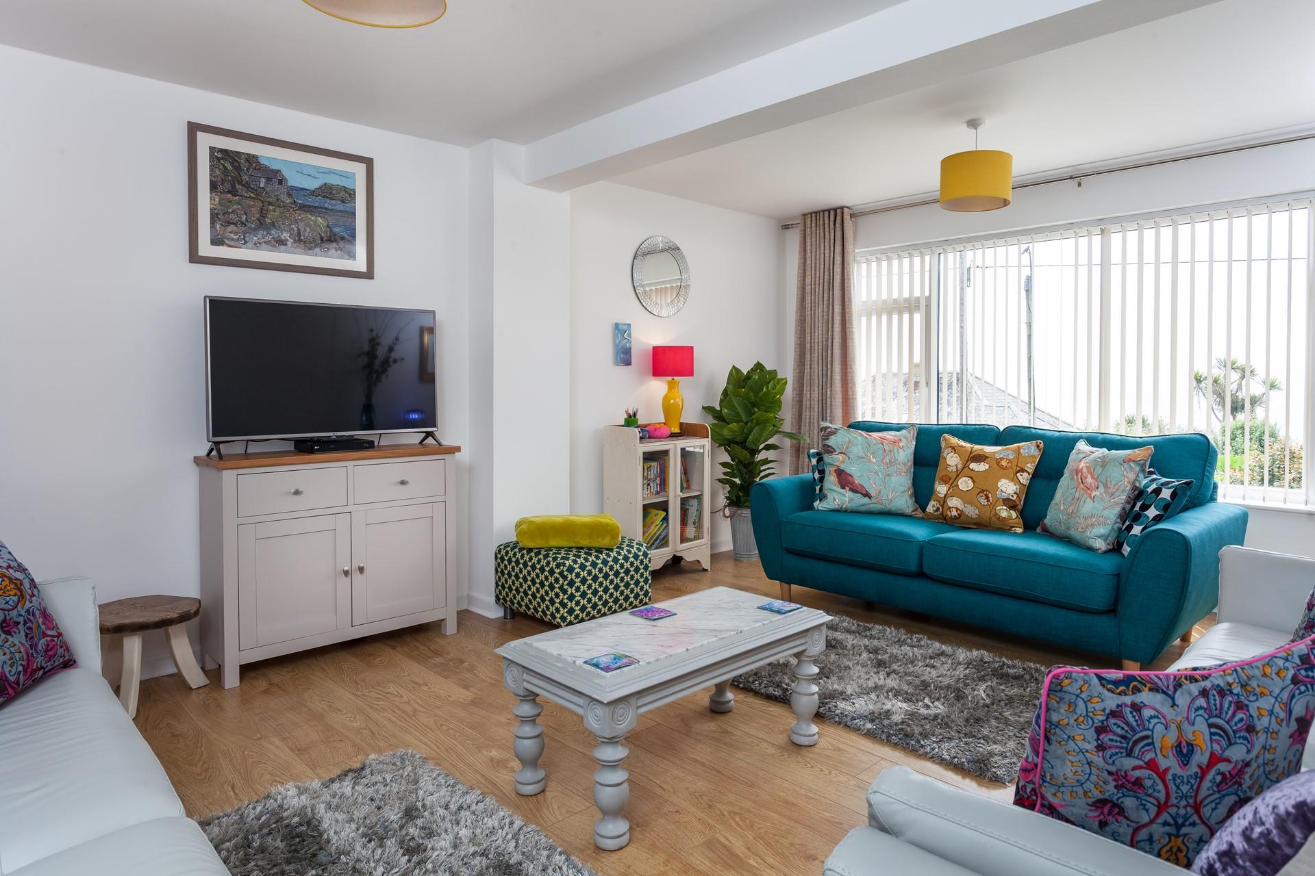 Cosy with sea views, the lounge is the perfect space to gather your family for a movie night over a takeaway! 