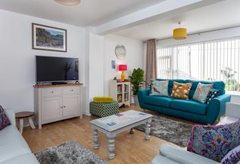 Cosy with sea views, the lounge is the perfect space to gather your family for a movie night over a takeaway! 