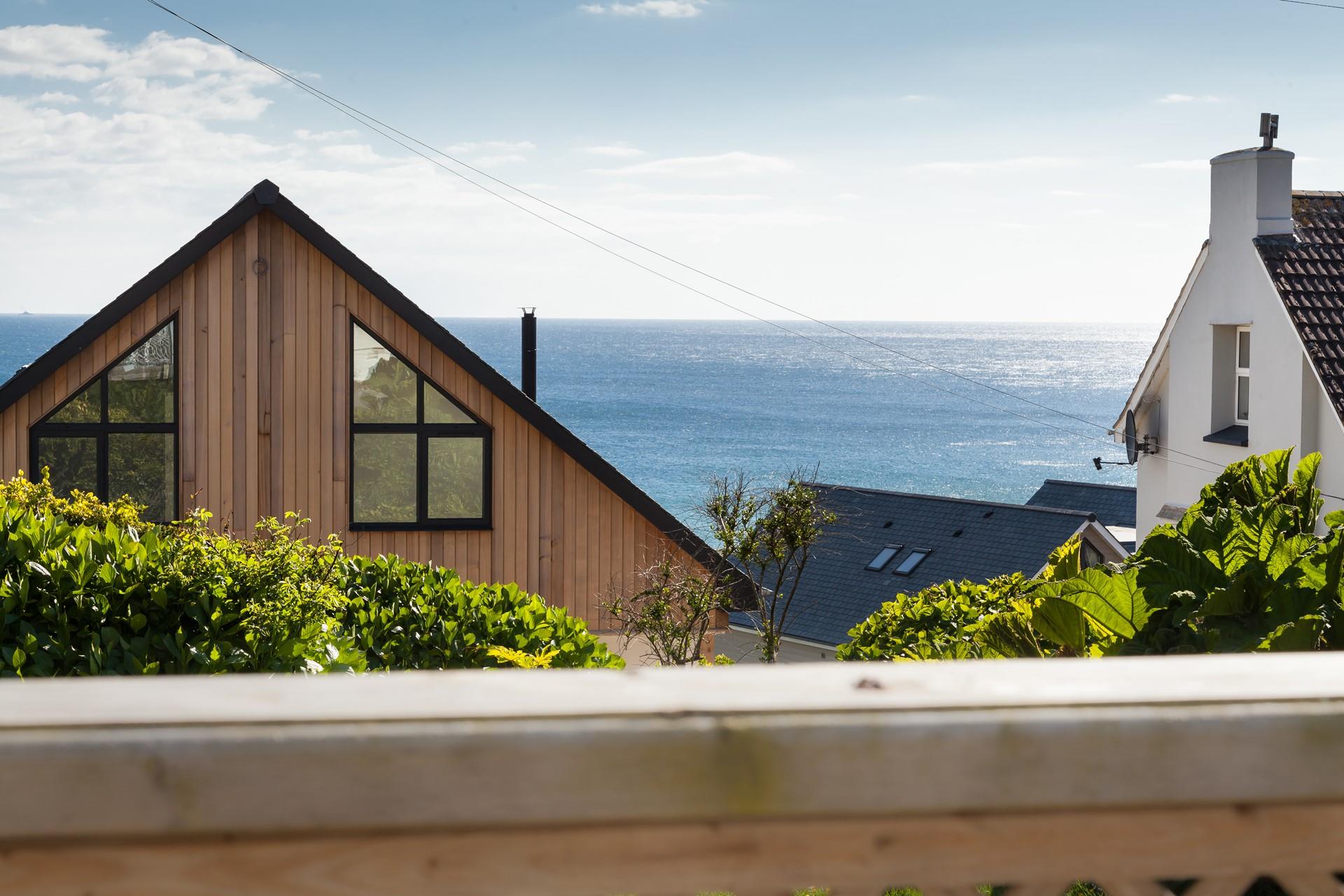 The decking area is enhanced by glorious sea views!