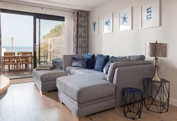 The comfortable sofa and the nautical-themed decor make the living area a relaxing space for cosying up in the evening. 