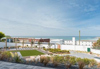 The communal garden is a tranquil space for relaxing with a book on a warm afternoon. 