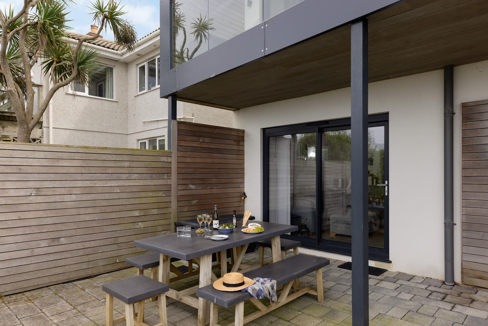 Tuck into wine and nibbles on the patio.