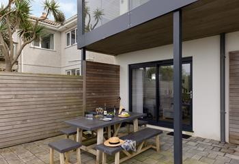 Tuck into wine and nibbles on the patio.