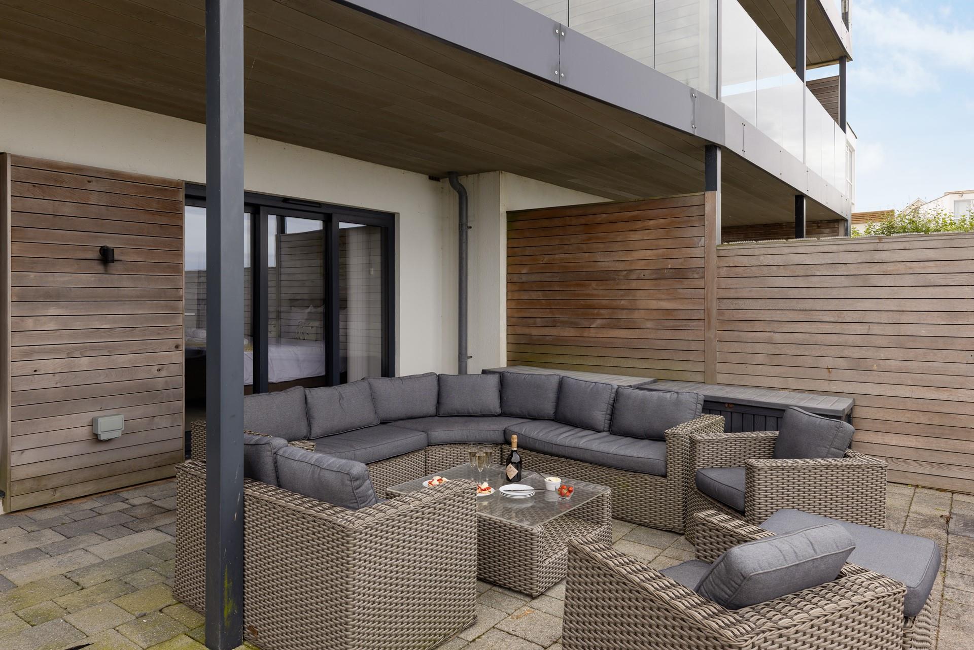 Comfortable lounge furniture is perfect for relaxing after the beach and watching the sun set over Fistral beach.