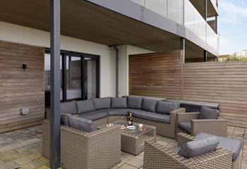 Comfortable lounge furniture is perfect for relaxing after the beach and watching the sun set over Fistral beach.