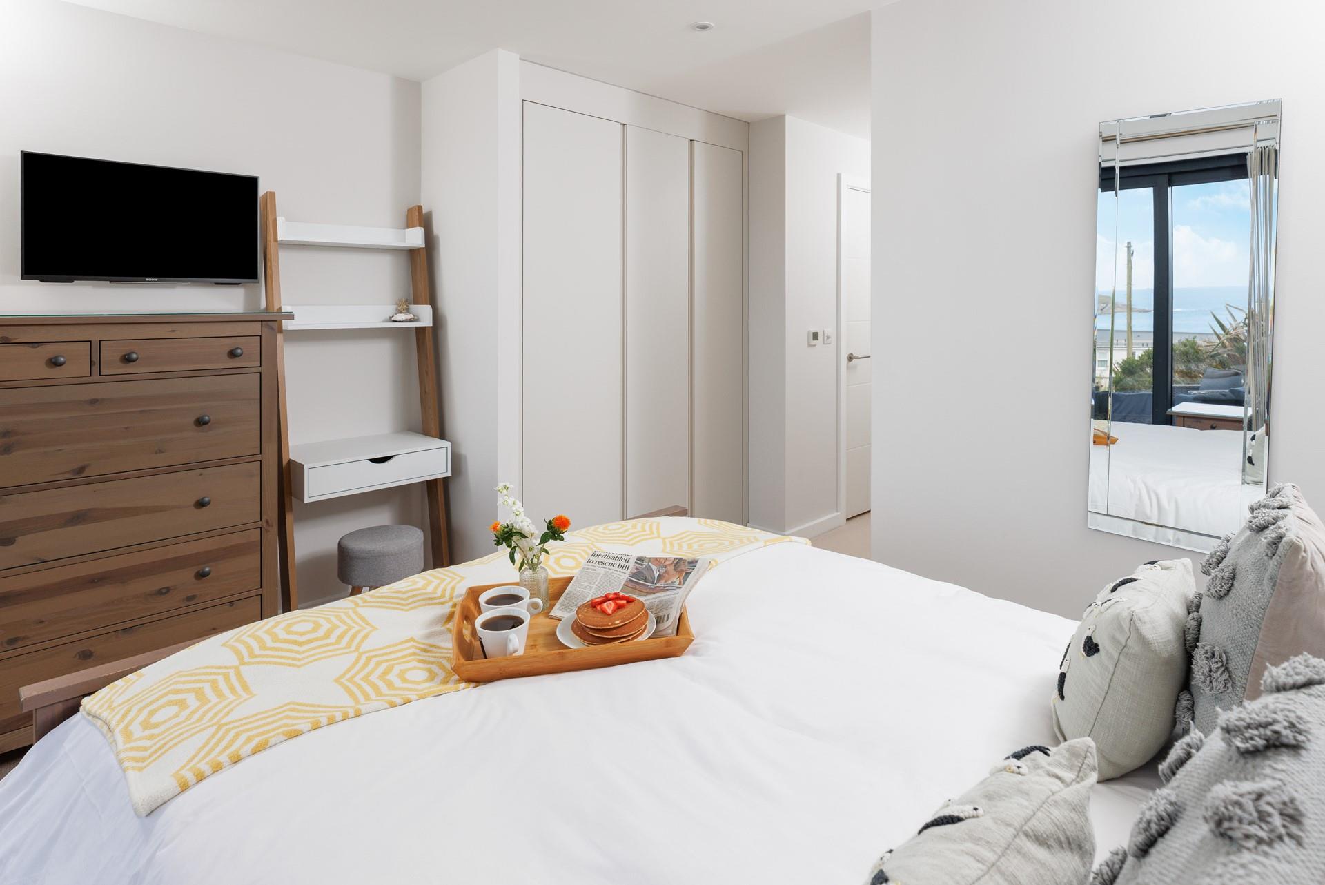 The spacious king-size bed offers a dreamy night's sleep.