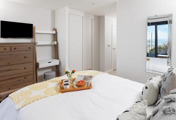 The spacious king-size bed offers a dreamy night's sleep.