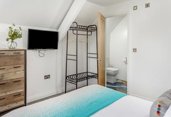 Climb out the king size bed and into the en suite to get ready for the day.