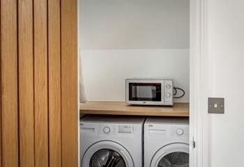 The utility room has a washing machine and tumble dryer perfect for washing beach clothes.