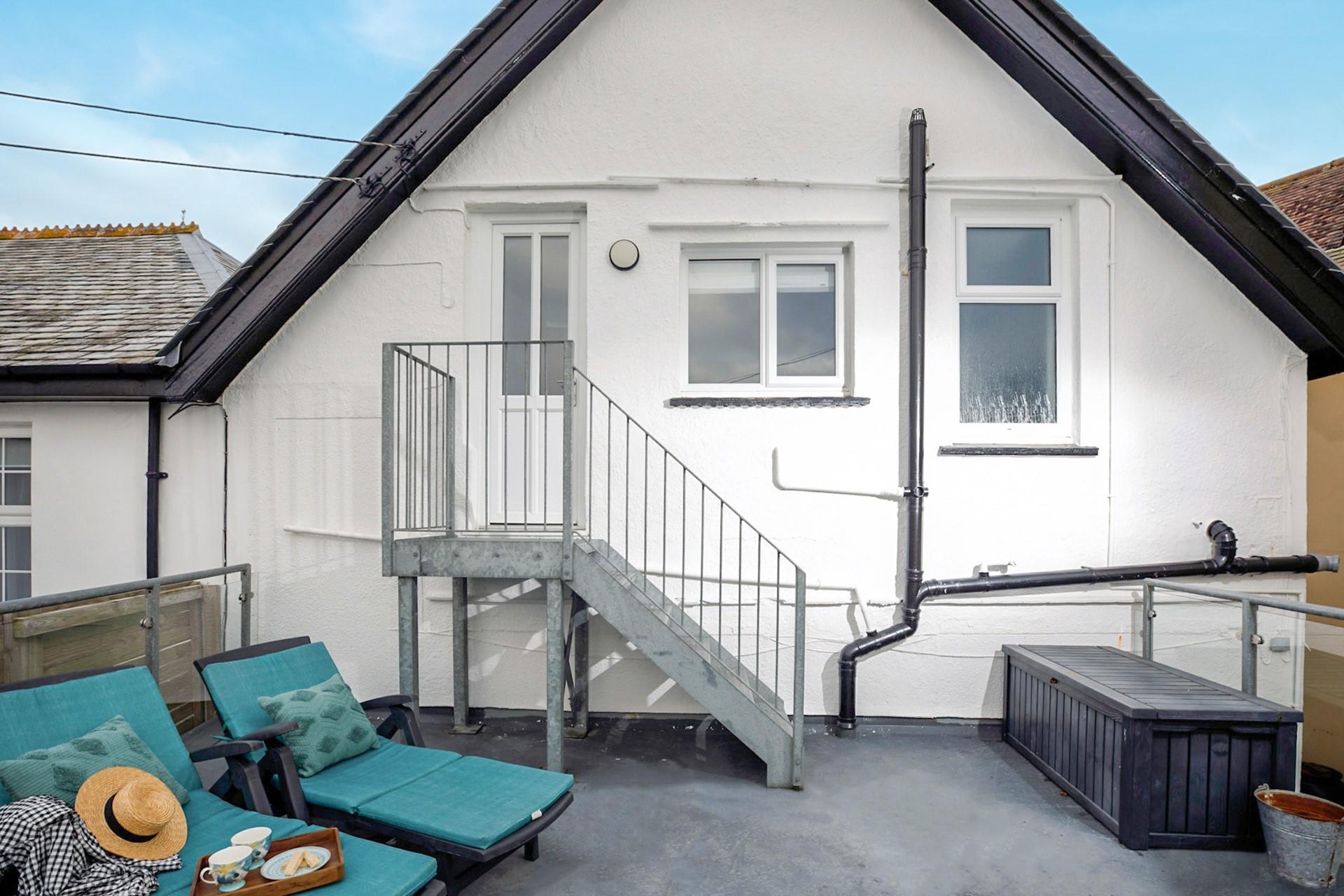 Enjoy relaxing on the roof terrace, accessed from the living area.