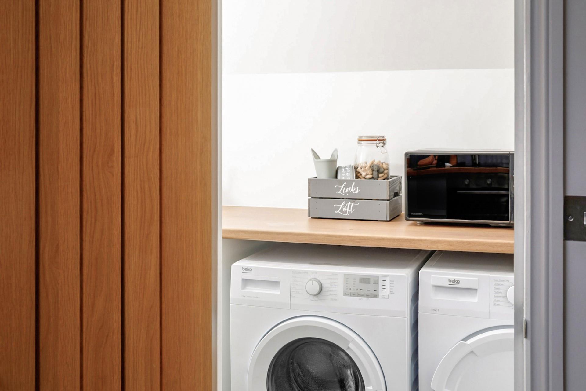 The utility room has a washing machine and tumble dryer perfect for washing beach clothes.