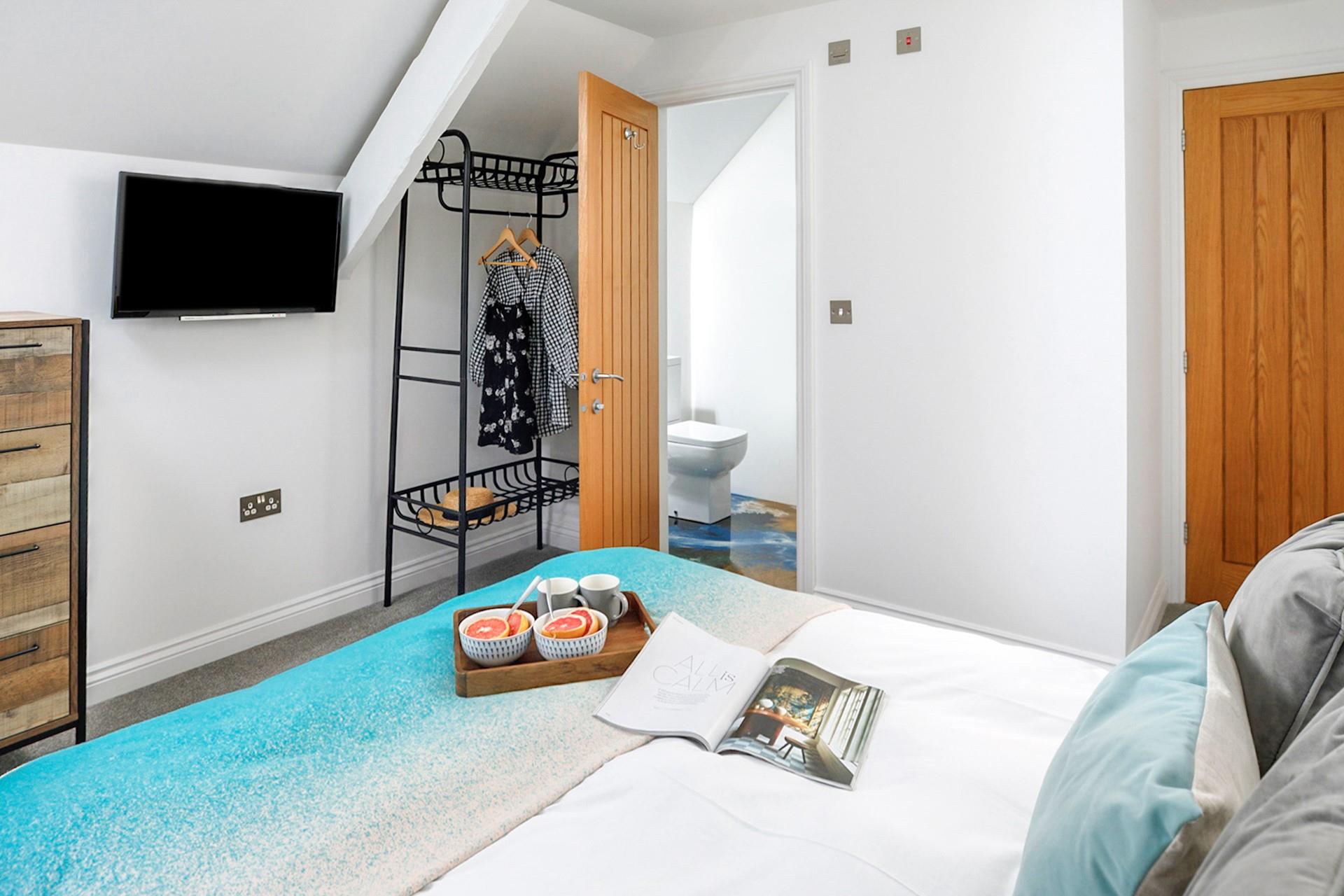 Climb out the king size bed and into the en suite to get ready for the day.