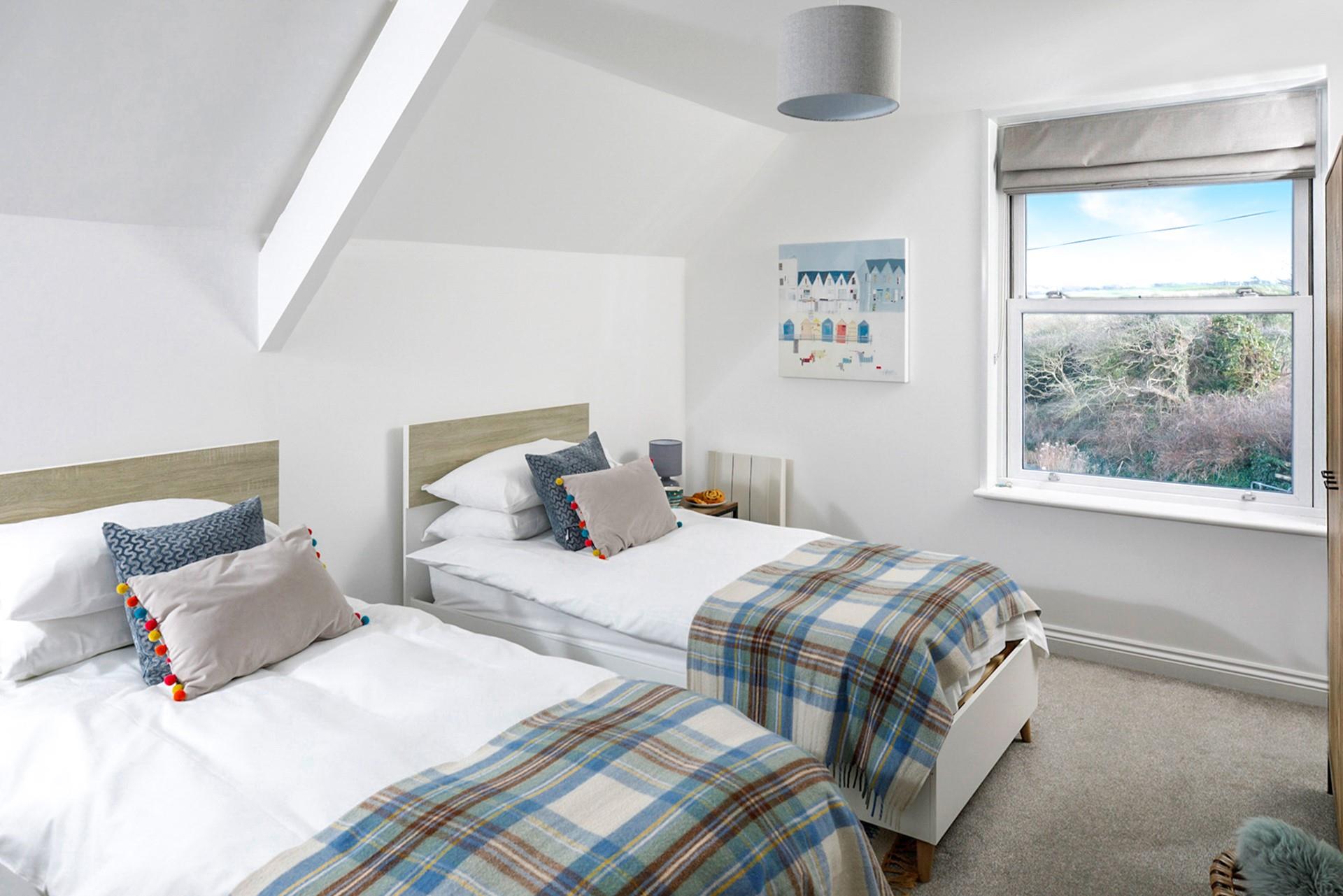 The twin room is perfectly designed for two, overlooking the greens of the golf course!