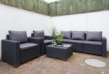 An enclosed patio area at the rear of the property is the perfect space for some al fresco dining. 