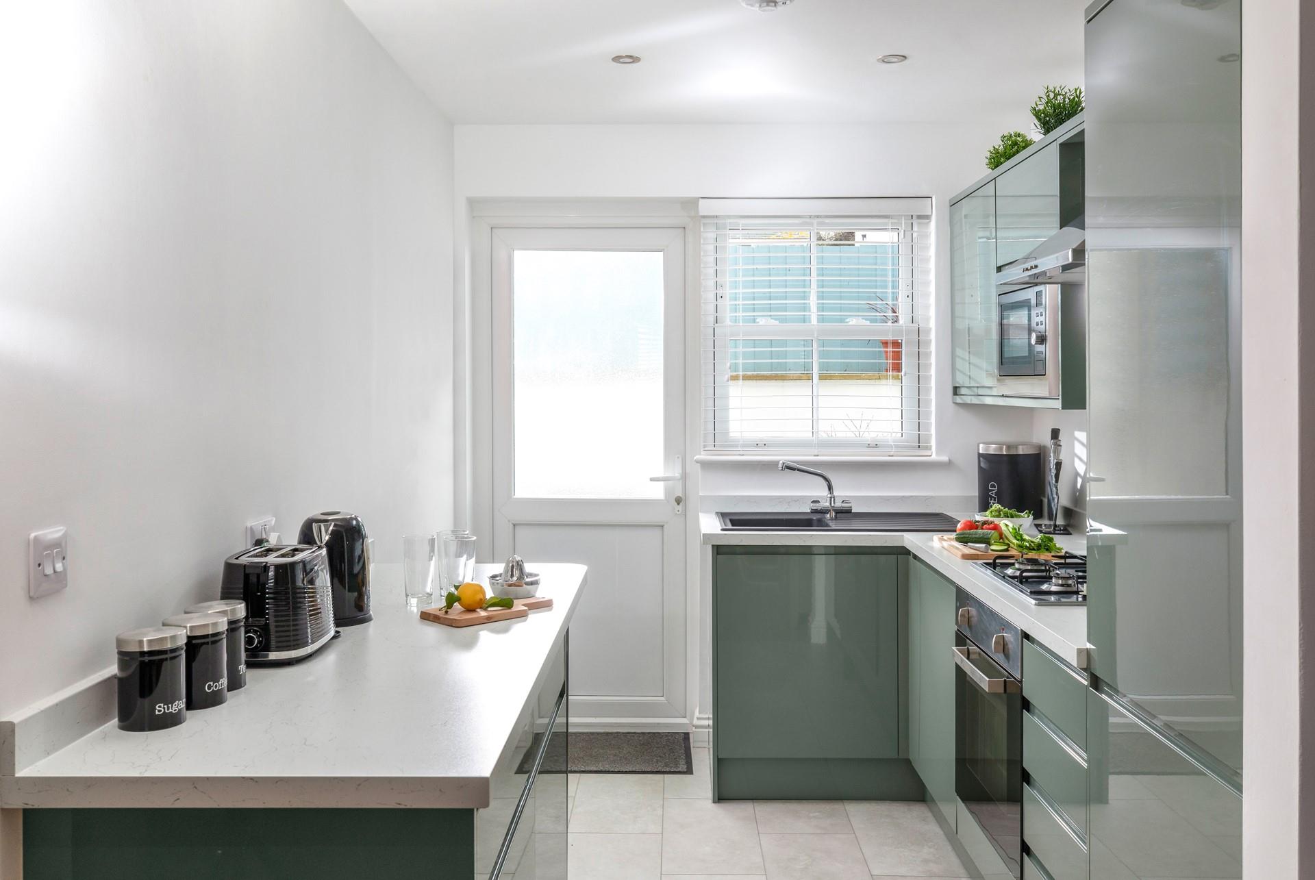 The contemporary kitchen makes whipping up delicious meals an absolute pleasure.