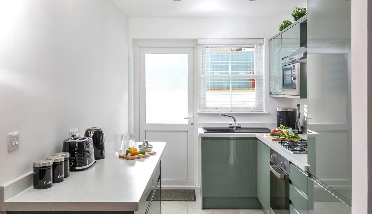 The contemporary kitchen makes whipping up delicious meals an absolute pleasure.