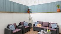 Fully enclosed, the patio is a great spot for unwinding and perfect for dogs!