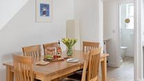 Gather at the dining table to enjoy family meals, making magical memories that will last a lifetime.