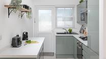 The contemporary kitchen makes whipping up delicious meals an absolute pleasure.