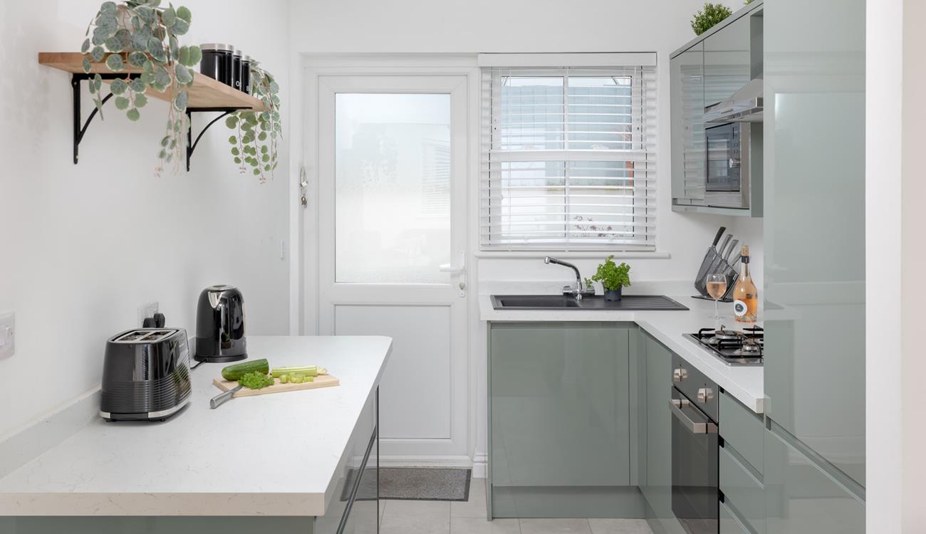 The contemporary kitchen makes whipping up delicious meals an absolute pleasure.