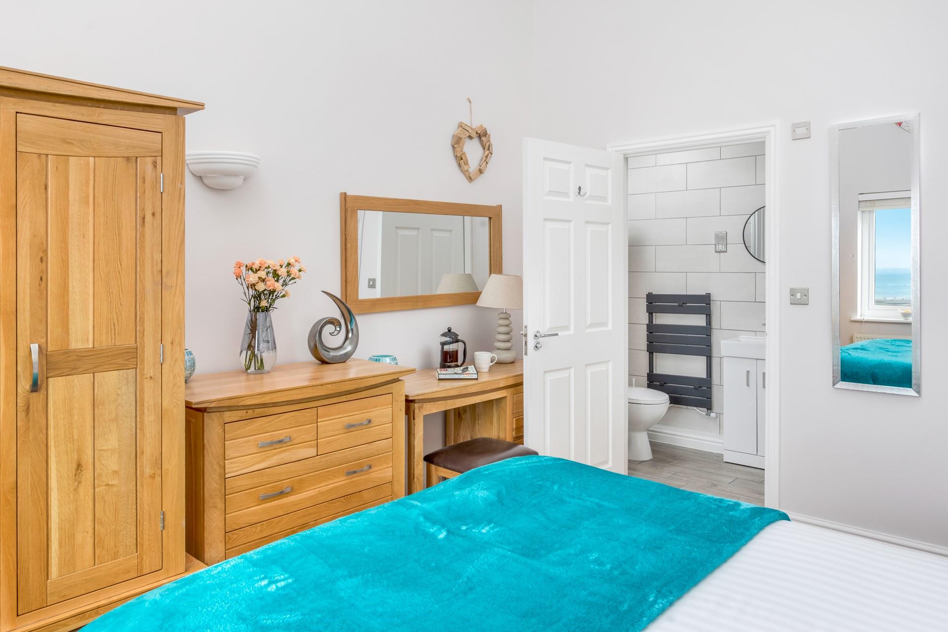Wake up and head into the en suite to get ready for a beach day.