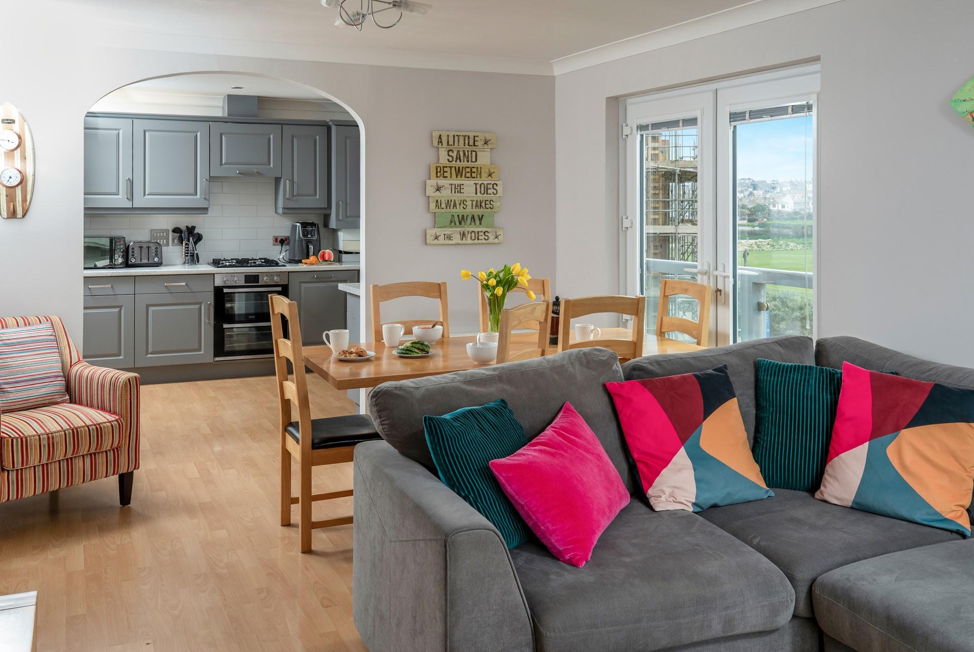 Sink into the cosy sofa with a glass of something cold in hand.