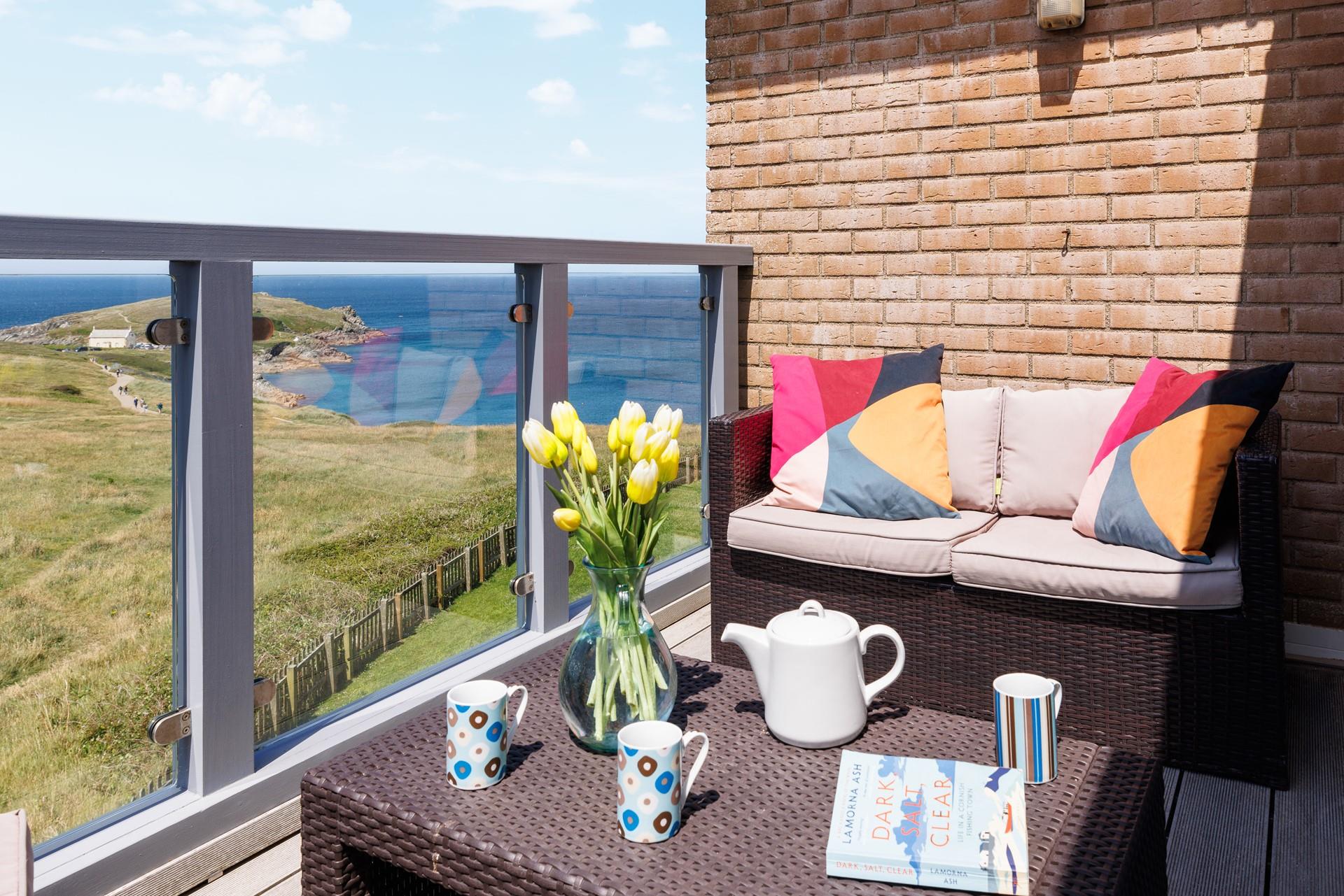 Soak up the sun and the views out on the balcony.