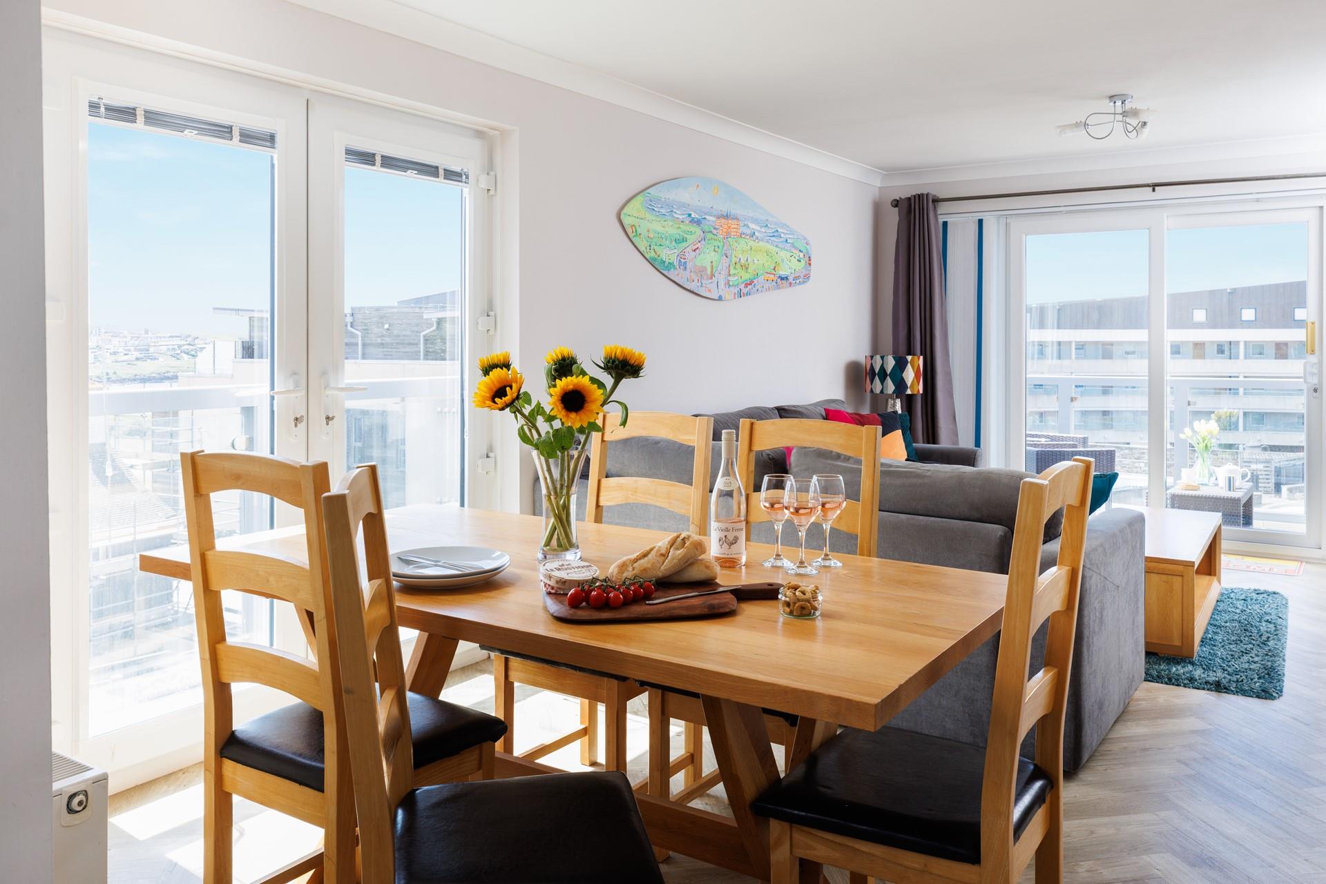 Sit around the dining table together and enjoy a delicious meal.