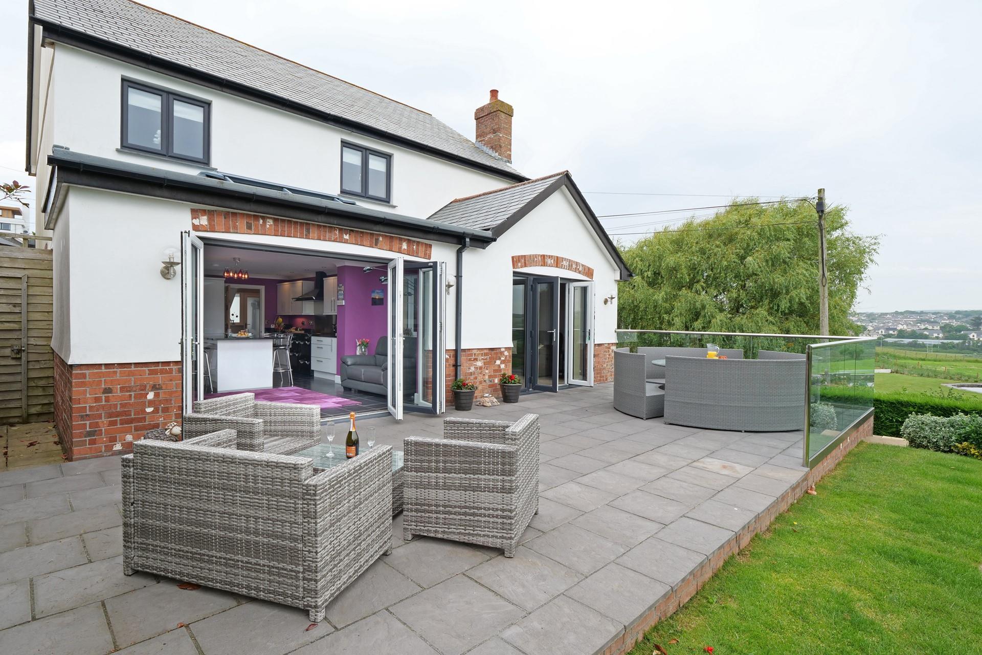 Relax on the rattan furniture with a glass of something cold.