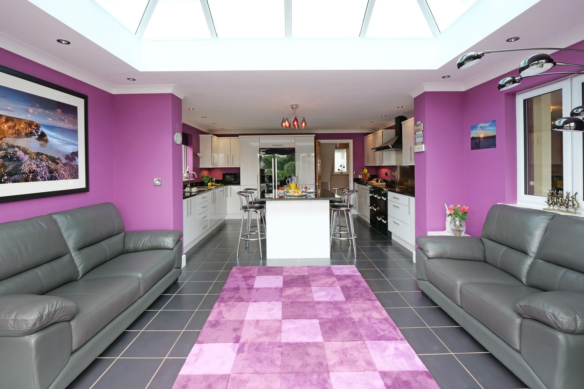 The kitchen is flooded with light from the skylight.