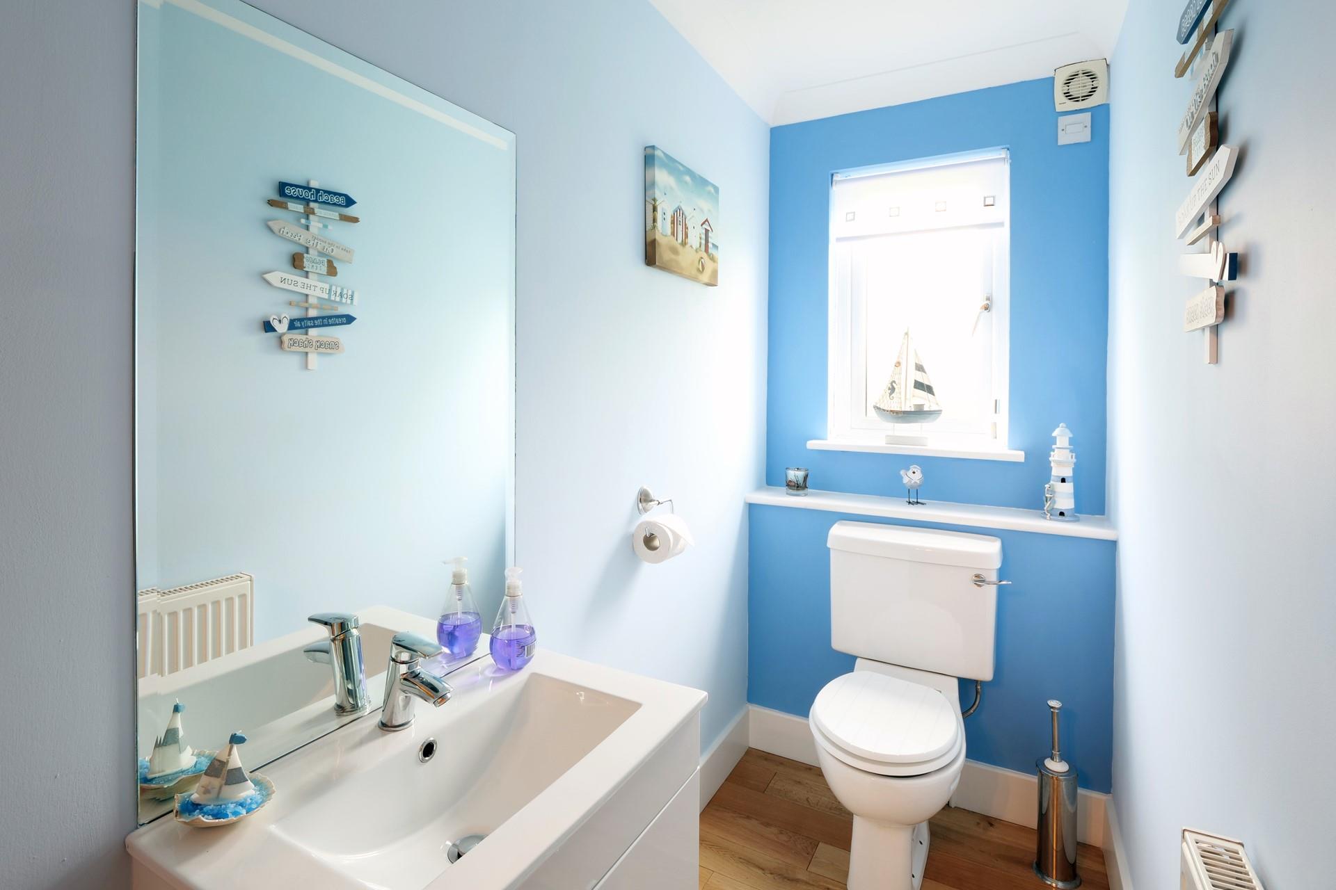 We love the coastal theme in the ground floor cloakroom.
