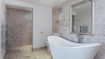Enjoy fresh warm towels straight from the heated towel rail after a relaxing bubble bath.