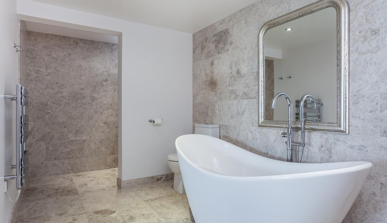 Enjoy fresh warm towels straight from the heated towel rail after a relaxing bubble bath.