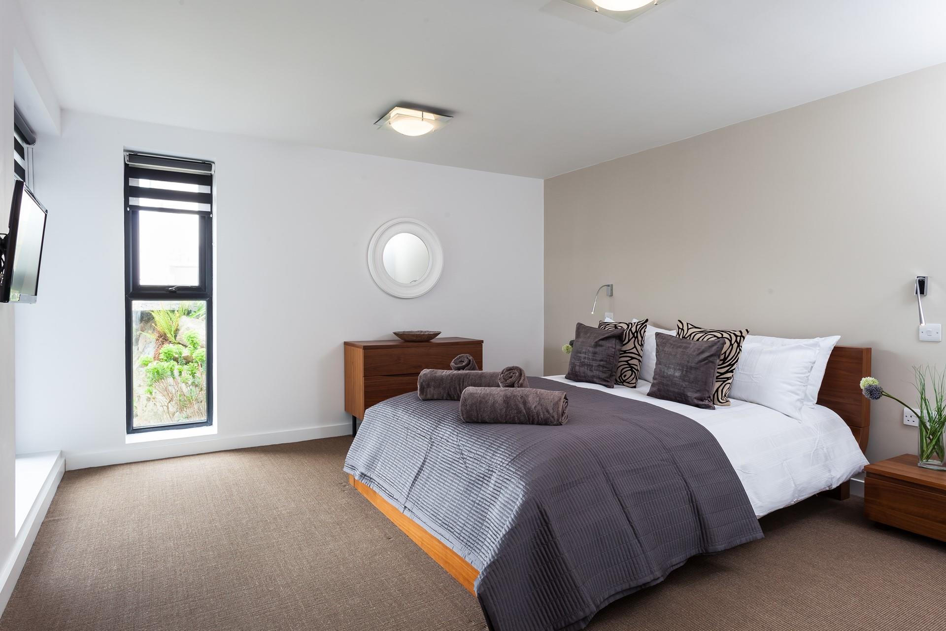 Sip your morning coffee from the spacious bed while deciding on the day's plans.