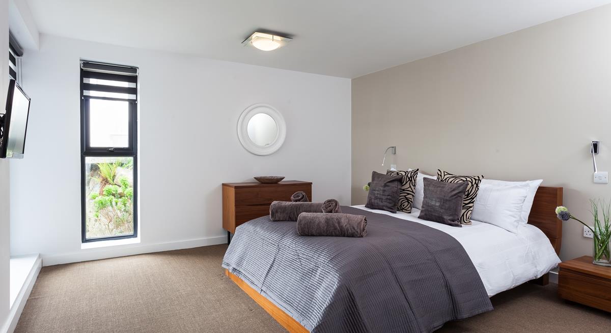 Sip your morning coffee from the spacious bed while deciding on the day's plans.